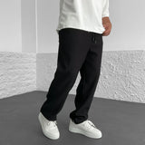 Pantalones ajustados elásticos para hombre