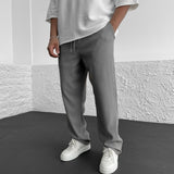 Pantalones ajustados elásticos para hombre