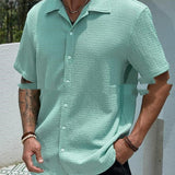 Camisa de hombre de color sólido con botones y solapa de manga corta