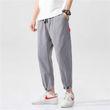 Pantalones ajustados de corte relajado Theo Navarro