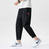 Pantalones ajustados de corte relajado Theo Navarro